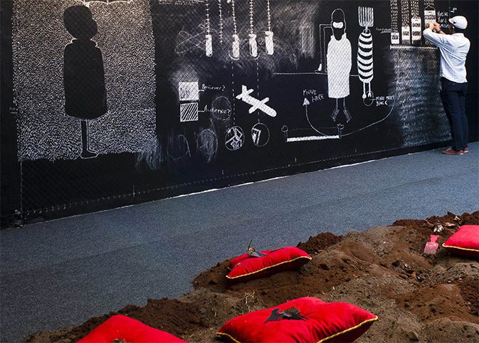 Kemang Wa Lehulere, 'Remembering the Future of a Hole as a Verb 1' (Installation/Performance at Kwazulu Natal Society of Arts, Durban, 2010), chalk on black acrylic paint, nails, plastic string, soil, afro-combs, red velvet pillows. Courtesy: the artist and Lombard Freid Gallery.
