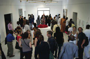 A section of Dak’Art 2012 with guests milling around the performance piece by South African artist Lerato Shadi © Ugochukwu-Smooth C. Nzewi