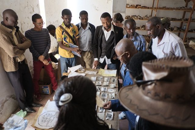 Revolution Room project, the community fro Cité Gécamines choosing objects in the Lubumbashi Museum collection for an exhibition in their neighborhood, 2014. Courtesy of Picha