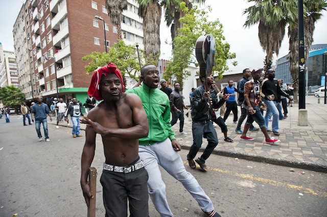 Men carrying sticks and stones was during the anti xenophobia march in Durban. Photo: Delwyn Verasamy