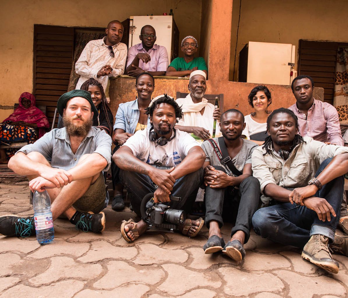 Malick Sidibé surrounded by Invisible Borders team, 2014. Courtesy of Emmanuel Iduma