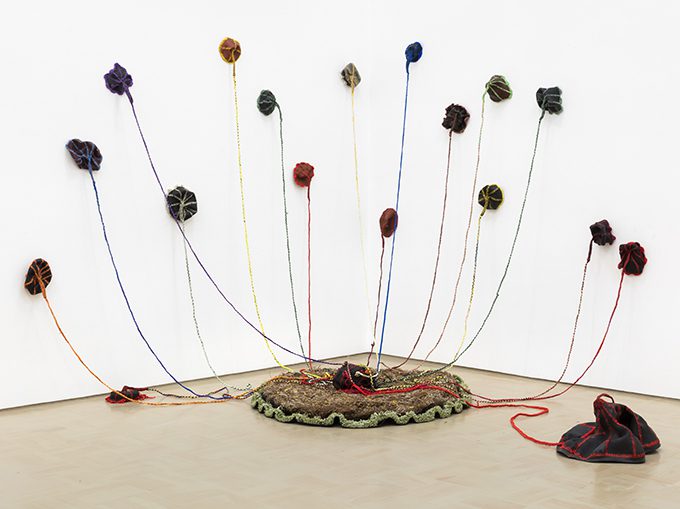 Nicholas Hlobo, Thoba, utsale umnxeba, 2008, performance sculpture (rubber inner tube, ribbon, impepho mat)
