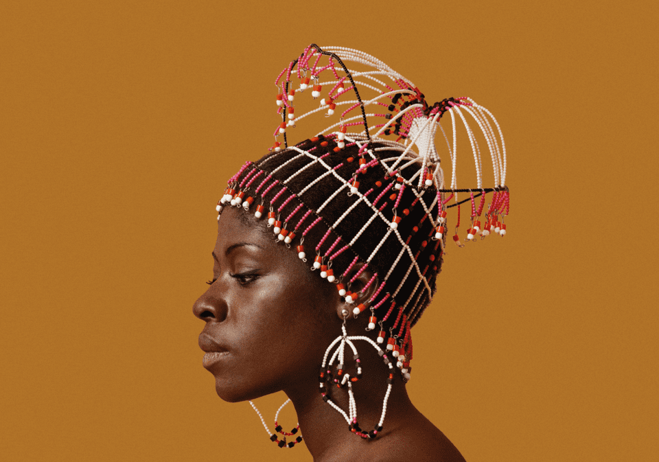 Kwame Brathwaite, Sikolo Brathwaite wearing a headpiece designed by
Carolee Prince, African Jazz-Art Society & Studios (AJASS), Harlem, ca. 1968; from Kwame Brathwaite: Black Is Beautiful (Aperture, 2019) Courtesy the artist and Philip Martin Gallery, Los Angeles