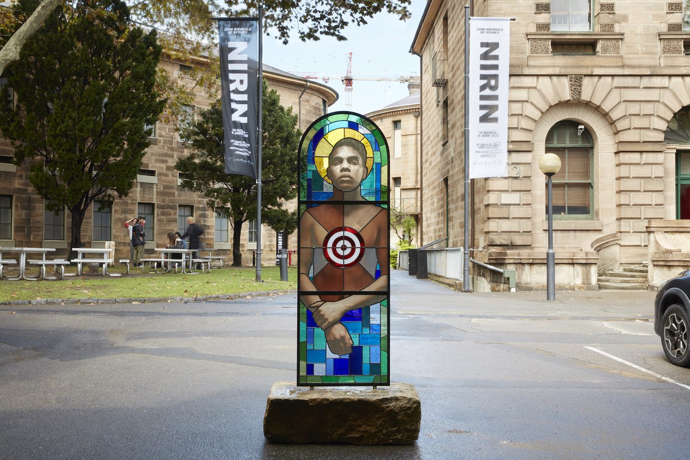 Tony Albert, Brothers (The Prodigal Son), 2020, glass, lead, photographic decal, steel, stone. Installation view (2020) for the 22nd Biennale of Sydney, National Art School. Courtesy the artist and Sullivan+Strumpf, Sydney. Photograph: Zan Wimberley