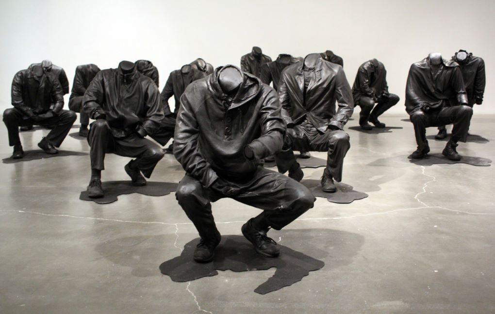 Haroon Gunn-Salie , Senzenina, 2018. Sculptural installation with sound element, 17 life-size crouching figures cast in Bronze 
Each figure approx: 70 x 100 cm 