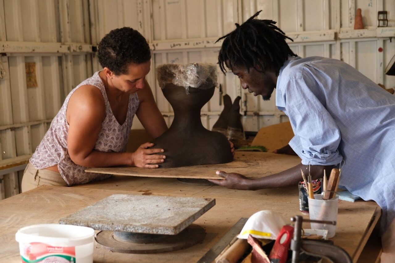 Kibe and Syowia working on a Kaspale sculpture, Image courtesy of Untethered Magic