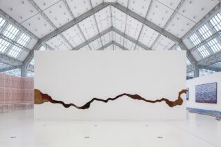 Otobong Nkanga, Anamnesis, 2015. Plywood, gauze, coffee, tea, spices, cacao, raw tobacco, peat, 204 3/5 x 451 1/5 inches. Installation view, Streamline. Oceans, Global Trade and Migration, the Deichtorhallen, Hamburg, 2015.	